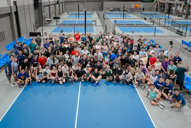Tela Park players gathered across the blue courts during a 140-player open play