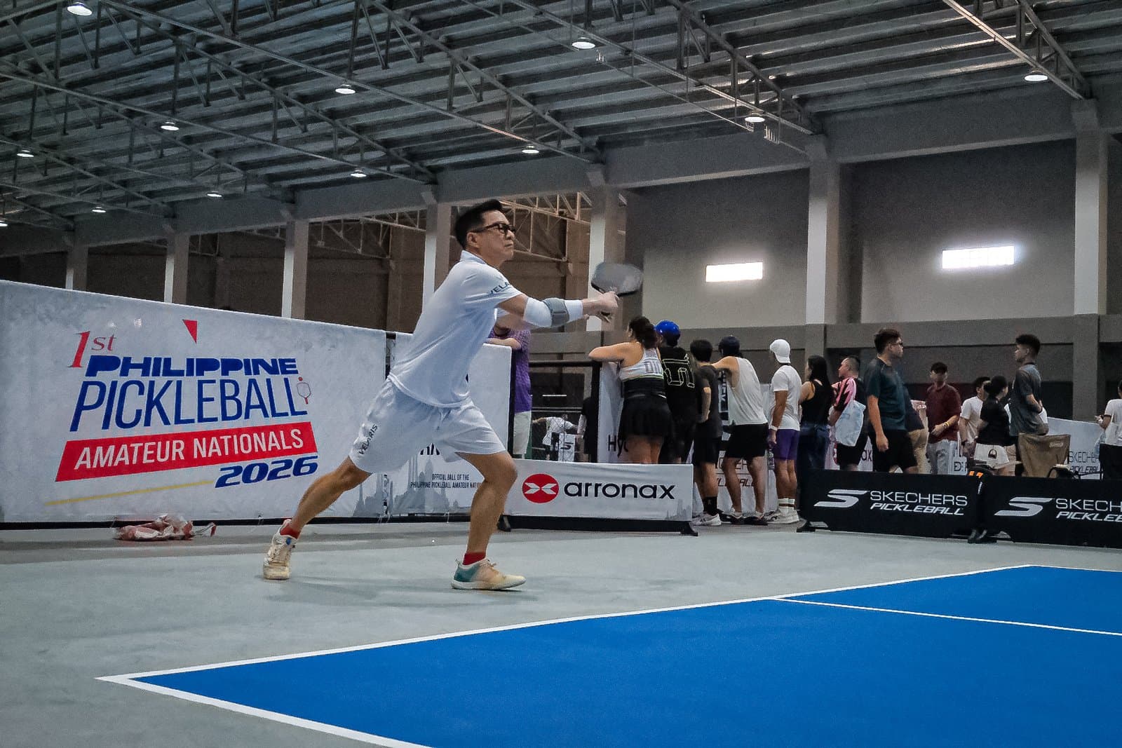 Players competing on Tela Park's blue courts